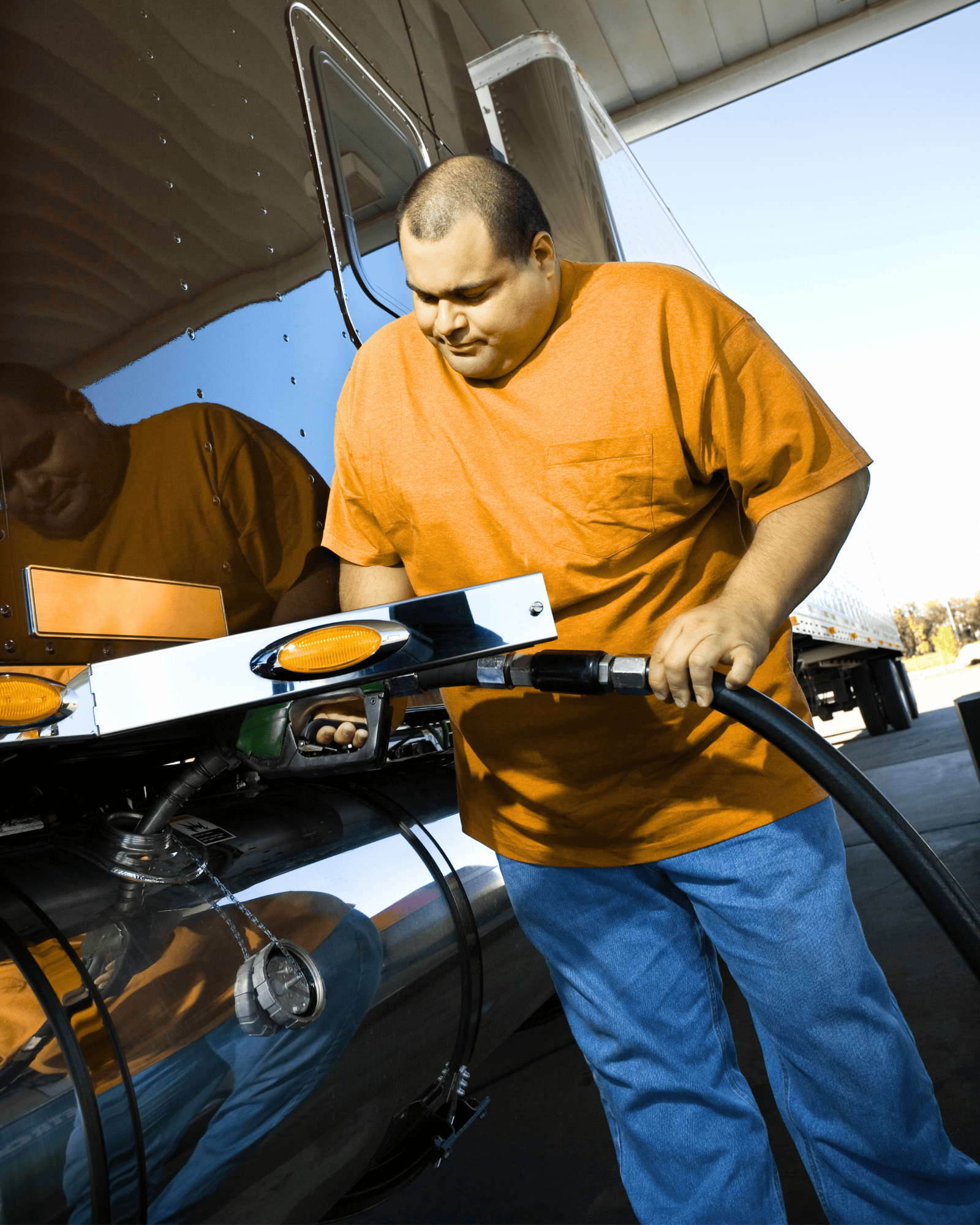 Owner-operator fueling his truck with diesel at a truck stop