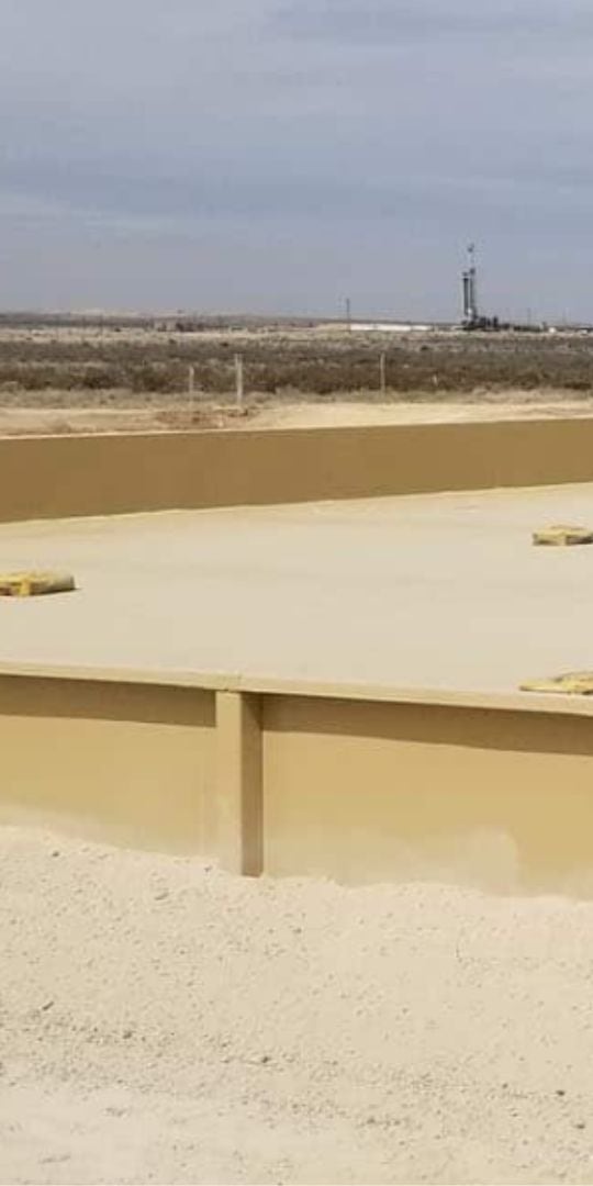 Lined secondary containment berm at a well site