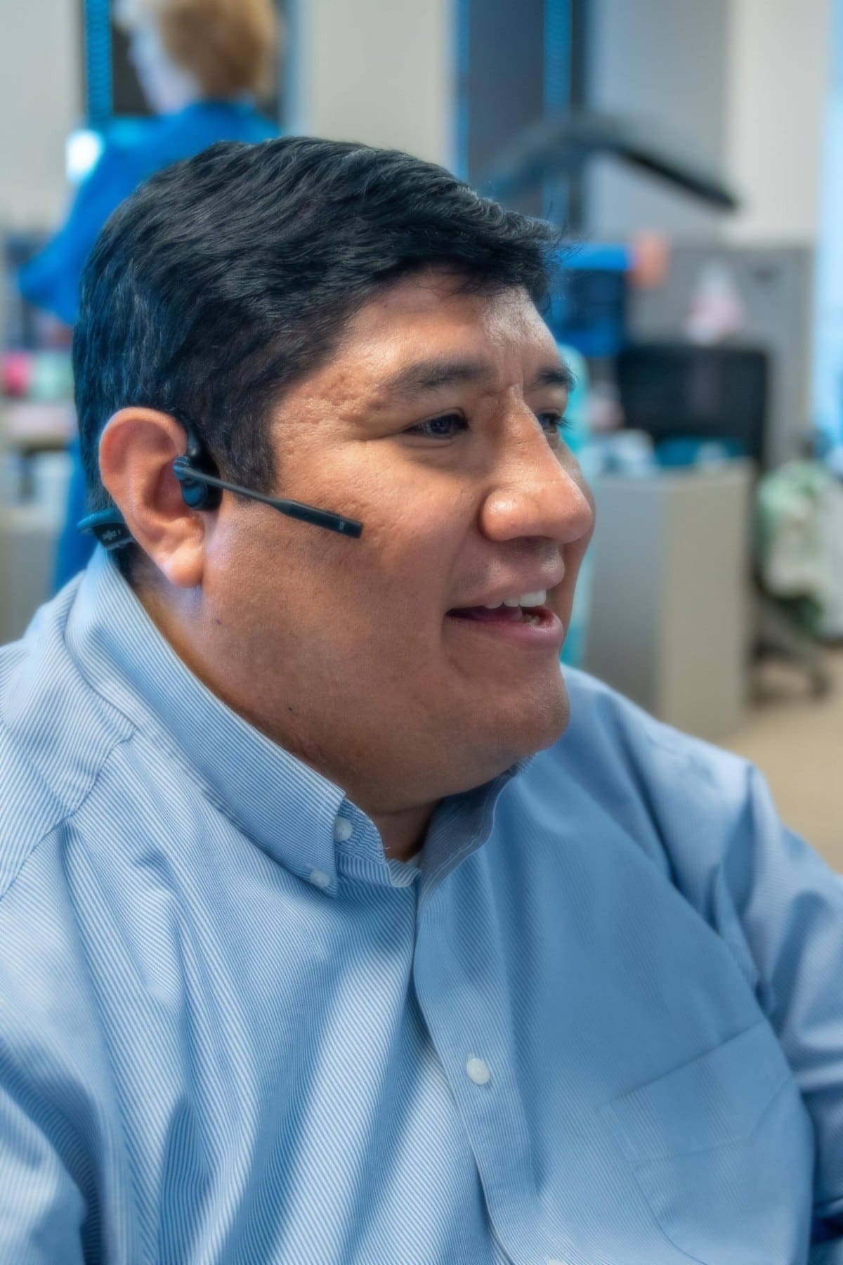 Oscar Tovar, Business Development Officer, taking a client call